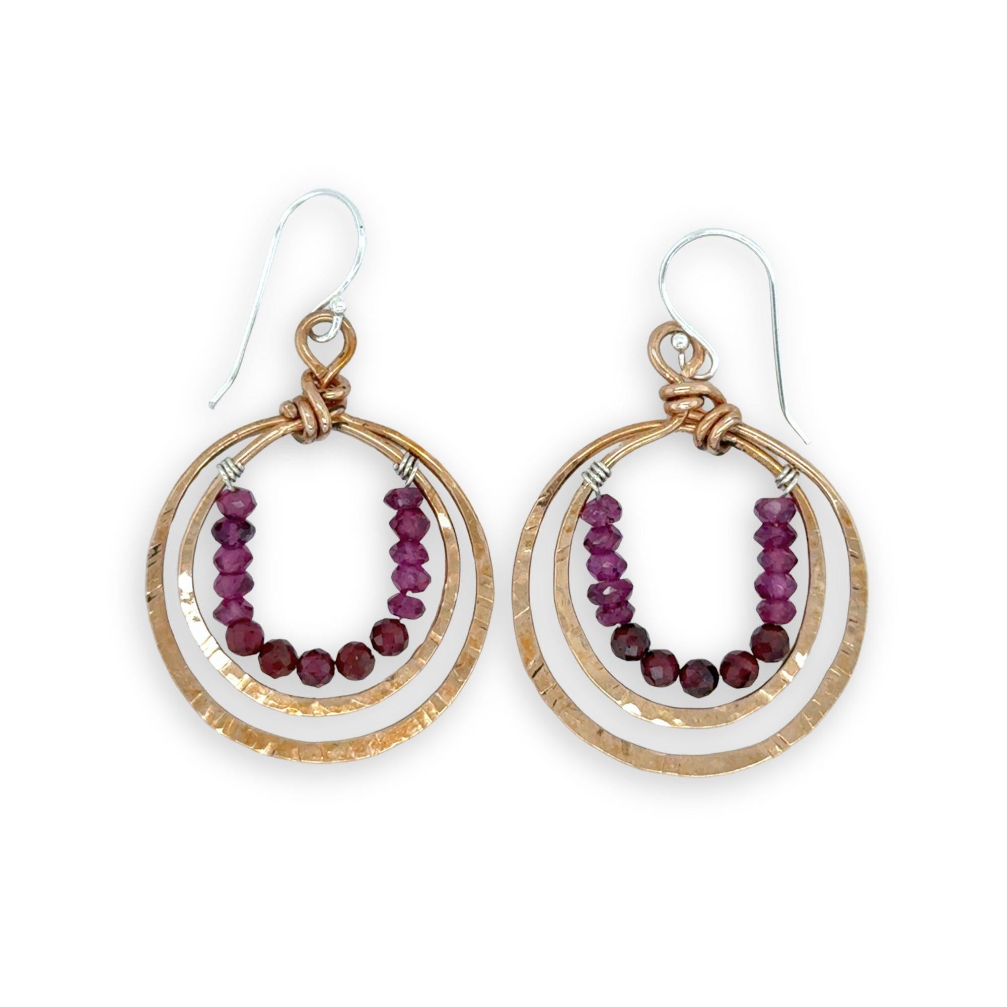 Stamped double bronze mini hoop earrings lined with two types of garnet faceted gemstones on sterling silver earring hooks