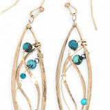 A pair of dangle bronze marquise earrings featuring hammered bronze and gold-filled designs with tiny faceted turquoise and chrysocolla gemstones.