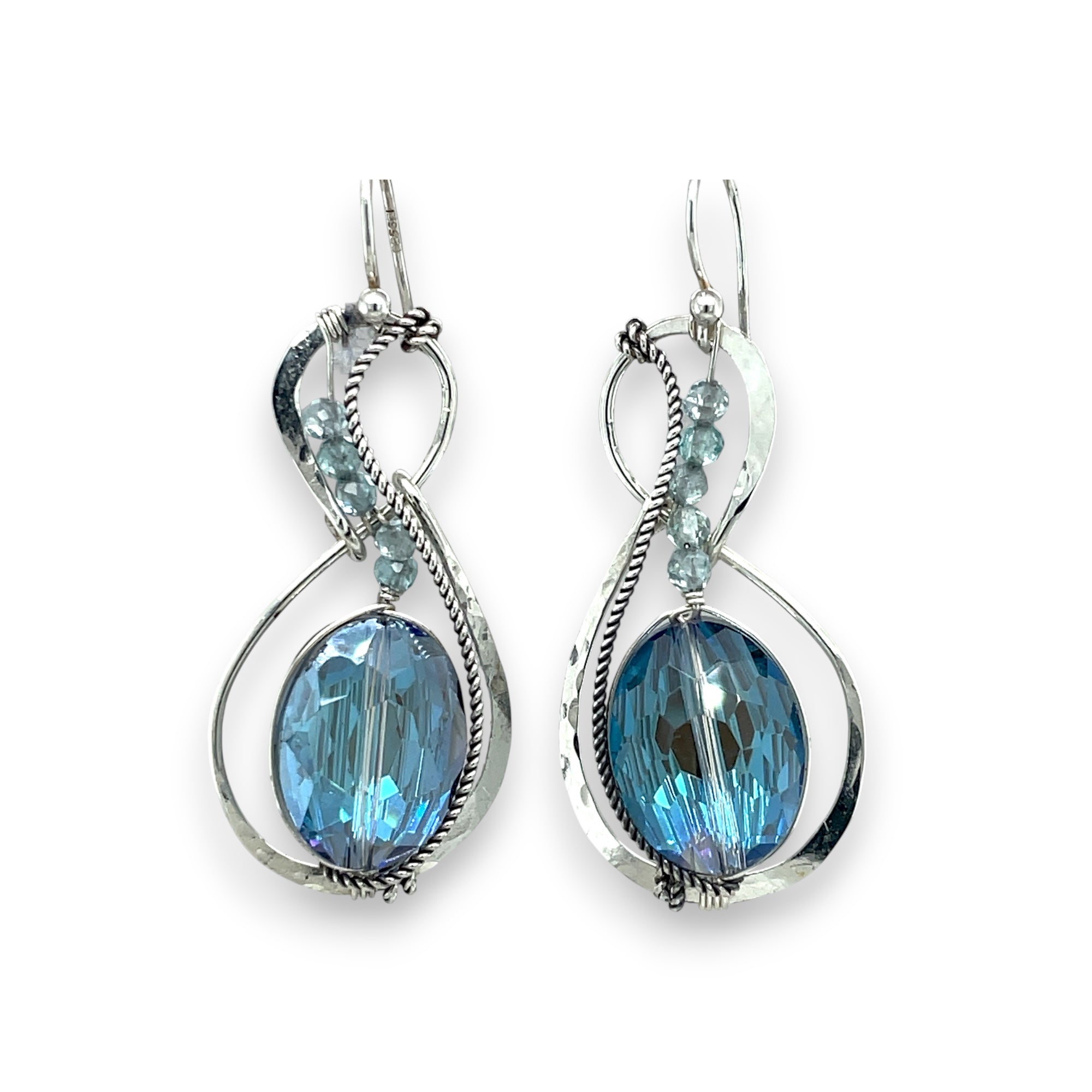 Pair of infinity shaped sterling silver earrings with blue crystal and apatite.