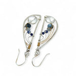 Sterling silver hammered wing earrings with quartz coin, aquamarine, crystal, and sodalite faceted gemstones with brass twist accents