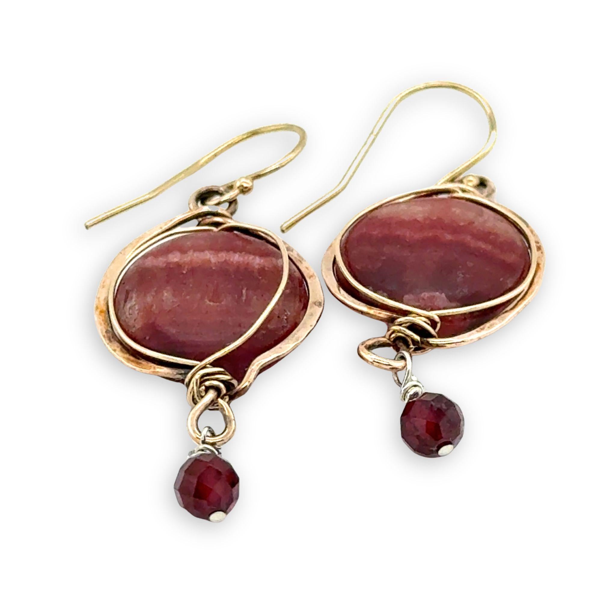 Red striped agate coins are held in hammered bronze wire earrings with garnet and gold filled accents