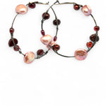 Oxidized sterling silver hoop earring with pink and deep red fresh water pearls and garnet gemstones