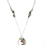 Fat sterling silver pendant with bronze wire, ruby zoisite, iolite, labradorite, apatite, and aquamarine on a long box chain with beaded swirls embedded into the chain