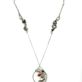 Fat sterling silver pendant with bronze wire, ruby zoisite, iolite, labradorite, apatite, and aquamarine on a long box chain with beaded swirls embedded into the chain