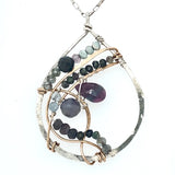 Fat sterling silver pendant with bronze wire, ruby zoisite, iolite, labradorite, apatite, and aquamarine on a long box chain with beaded swirls embedded into the chain