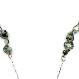 Fat sterling silver pendant with bronze wire, ruby zoisite, iolite, labradorite, apatite, and aquamarine on a long box chain with beaded swirls embedded into the chain