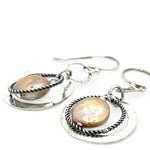 Handmade hammered and stamped sterling silver mini ring earrings with oxidized sterling silver twist rings holding a dangling champagne nude fresh water pearl coin