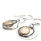 Handmade hammered and stamped sterling silver mini ring earrings with oxidized sterling silver twist rings holding a dangling champagne nude fresh water pearl coin