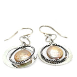 Handmade hammered and stamped sterling silver mini ring earrings with oxidized sterling silver twist rings holding a dangling champagne nude fresh water pearl coin