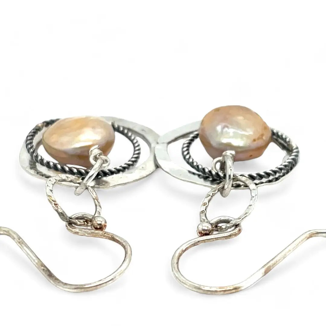 Handmade hammered and stamped sterling silver mini ring earrings with oxidized sterling silver twist rings holding a dangling champagne nude fresh water pearl coin