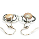 Handmade hammered and stamped sterling silver mini ring earrings with oxidized sterling silver twist rings holding a dangling champagne nude fresh water pearl coin