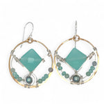 A pair of bronze hoop earrings with hammered sterling silver details and chalcedony gemstones, accented with silver blue fresh water pearls and fluorite gemstones