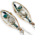 Bronze stamped marquise shaped earrings with smokey quartz, blue tourmaline, and green agate gemstones held within gold-filled wire