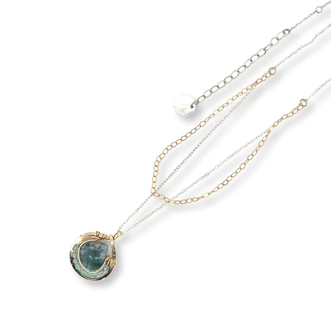 brass mini teardrop necklace filled with chalcedony and apatite gemstones surrounding a moss agate faceted drop gemstone in gold filled wire on a double mixed metal chain