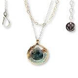 brass mini teardrop necklace filled with chalcedony and apatite gemstones surrounding a moss agate faceted drop gemstone in gold filled wire on a double mixed metal chain