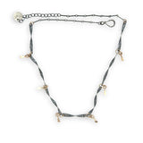 handmade hammered and twisted darkened sterling silver bars attached with gold filled rings accented with gold filled paddle charm necklace