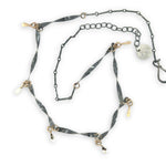 handmade hammered and twisted darkened sterling silver bars attached with gold filled rings accented with gold filled paddle charm necklace