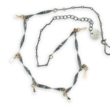 handmade hammered and twisted darkened sterling silver bars attached with gold filled rings accented with gold filled paddle charm necklace