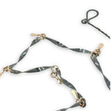 handmade hammered and twisted darkened sterling silver bars attached with gold filled rings accented with gold filled paddle charm necklace