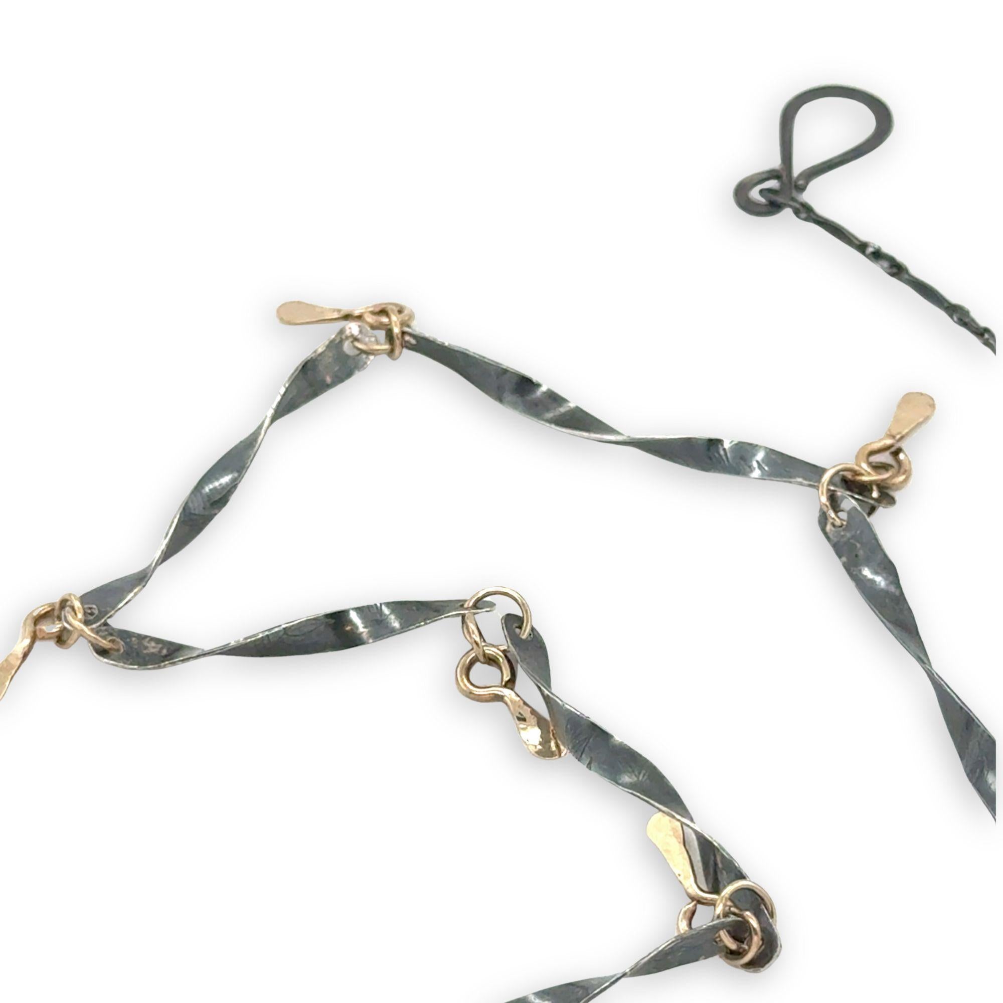 handmade hammered and twisted darkened sterling silver bars attached with gold filled rings accented with gold filled paddle charm necklace