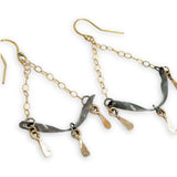 Stamped, hammered, and oxidized sterling silver twisted bars hanging from delicate gold chain with handmade gold filled paddle charm earrings