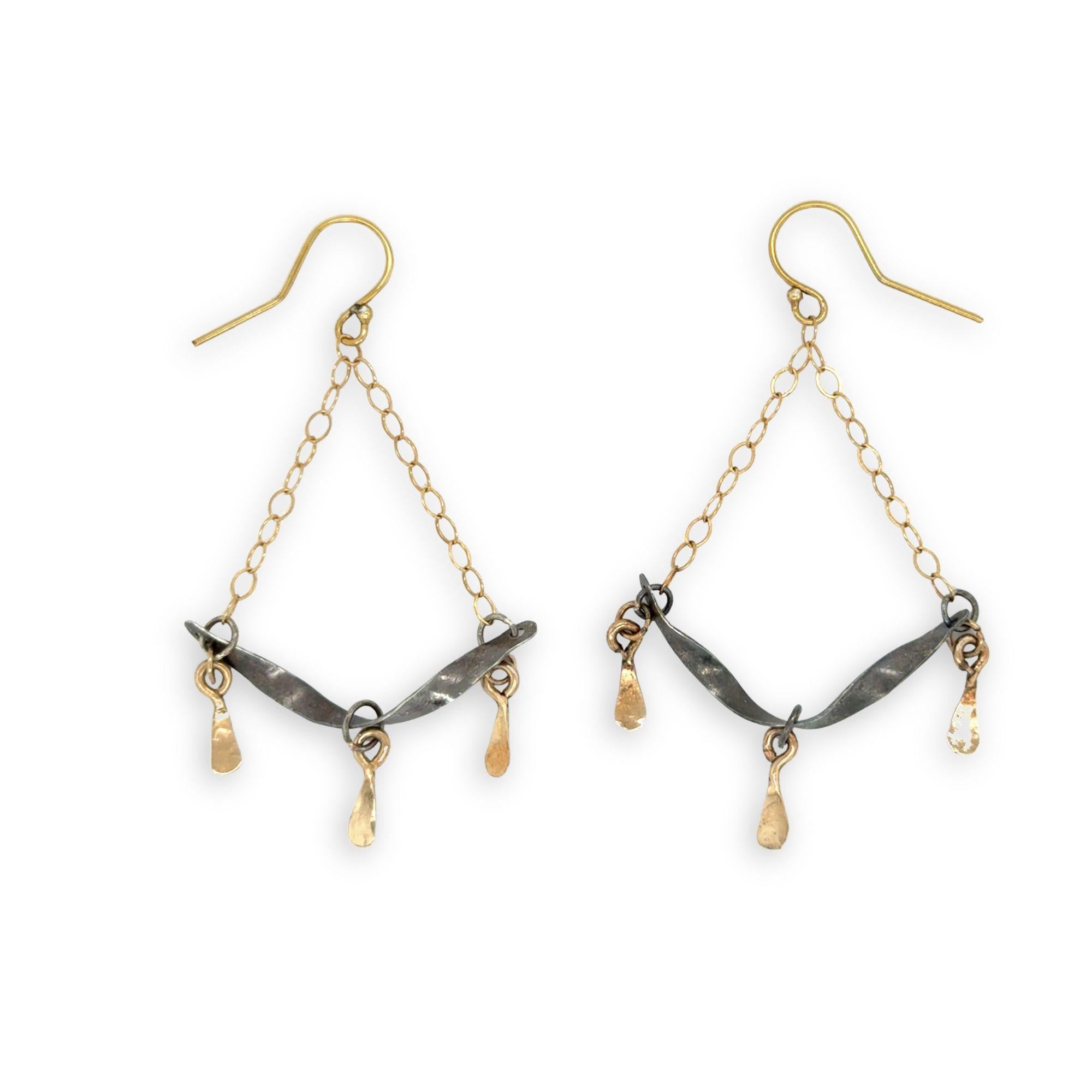 Stamped, hammered, and oxidized sterling silver twisted bars hanging from delicate gold chain with handmade gold filled paddle charm earrings