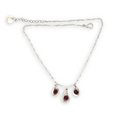 Sterling silver mini triple paisley pendant necklace with garnet faceted gemstones on a heart shaped delicate chain