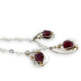 Sterling silver mini triple paisley pendant necklace with garnet faceted gemstones on a heart shaped delicate chain