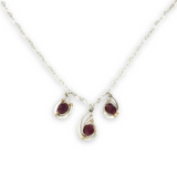 Sterling silver mini triple paisley pendant necklace with garnet faceted gemstones on a heart shaped delicate chain