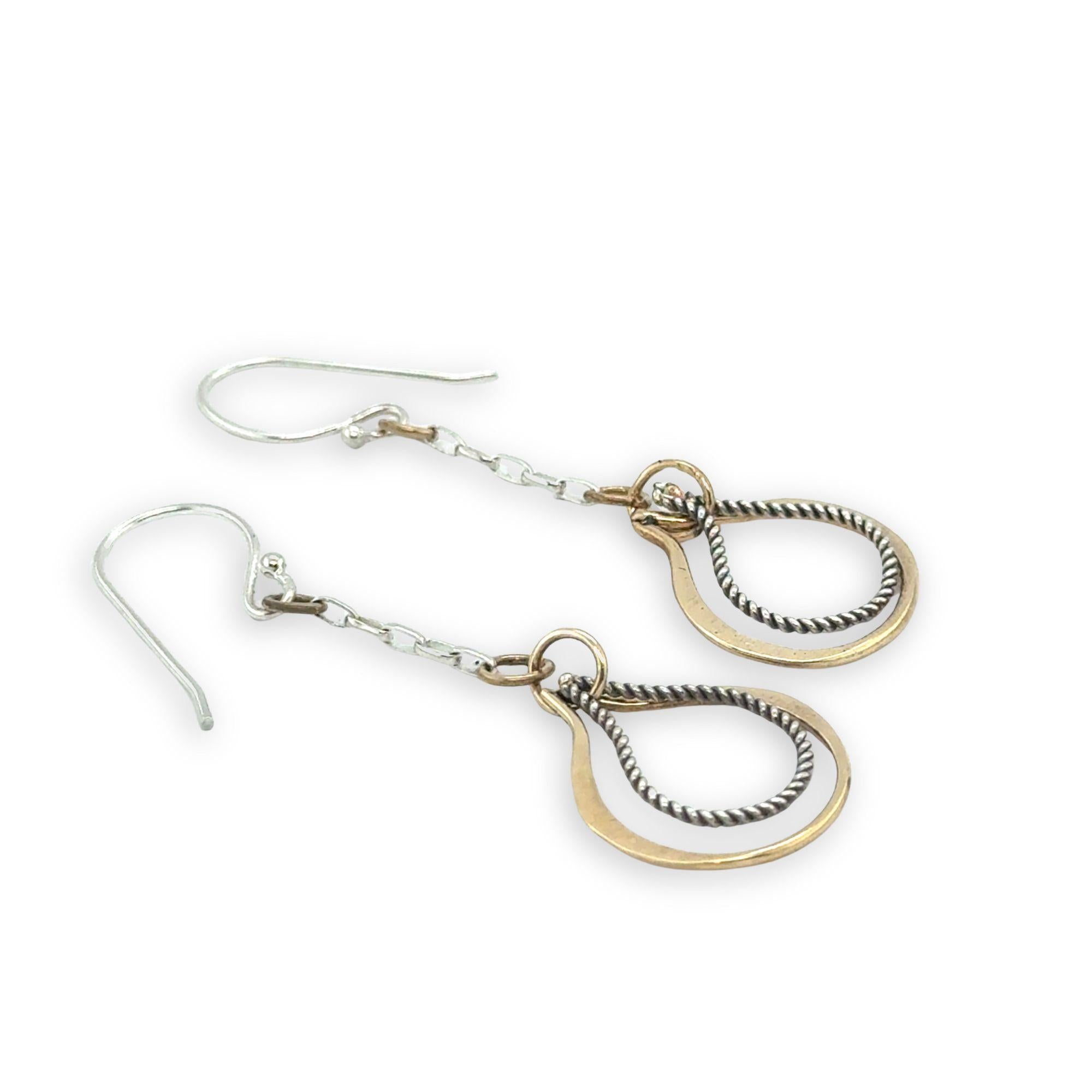 Hammered brass and oxidized sterling silver twist drop earrings on dainty chain