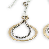 Hammered brass and oxidized sterling silver twist drop earrings on dainty chain