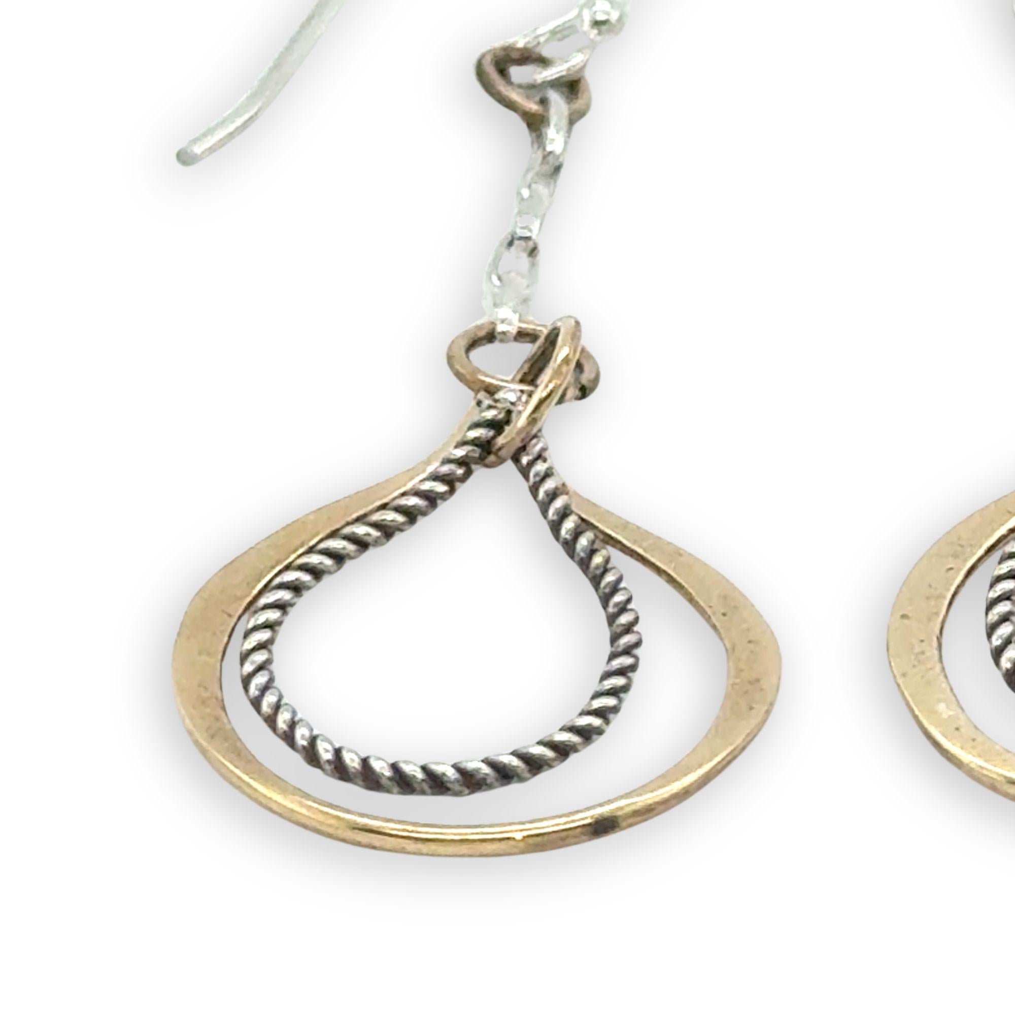 Hammered brass and oxidized sterling silver twist drop earrings on dainty chain