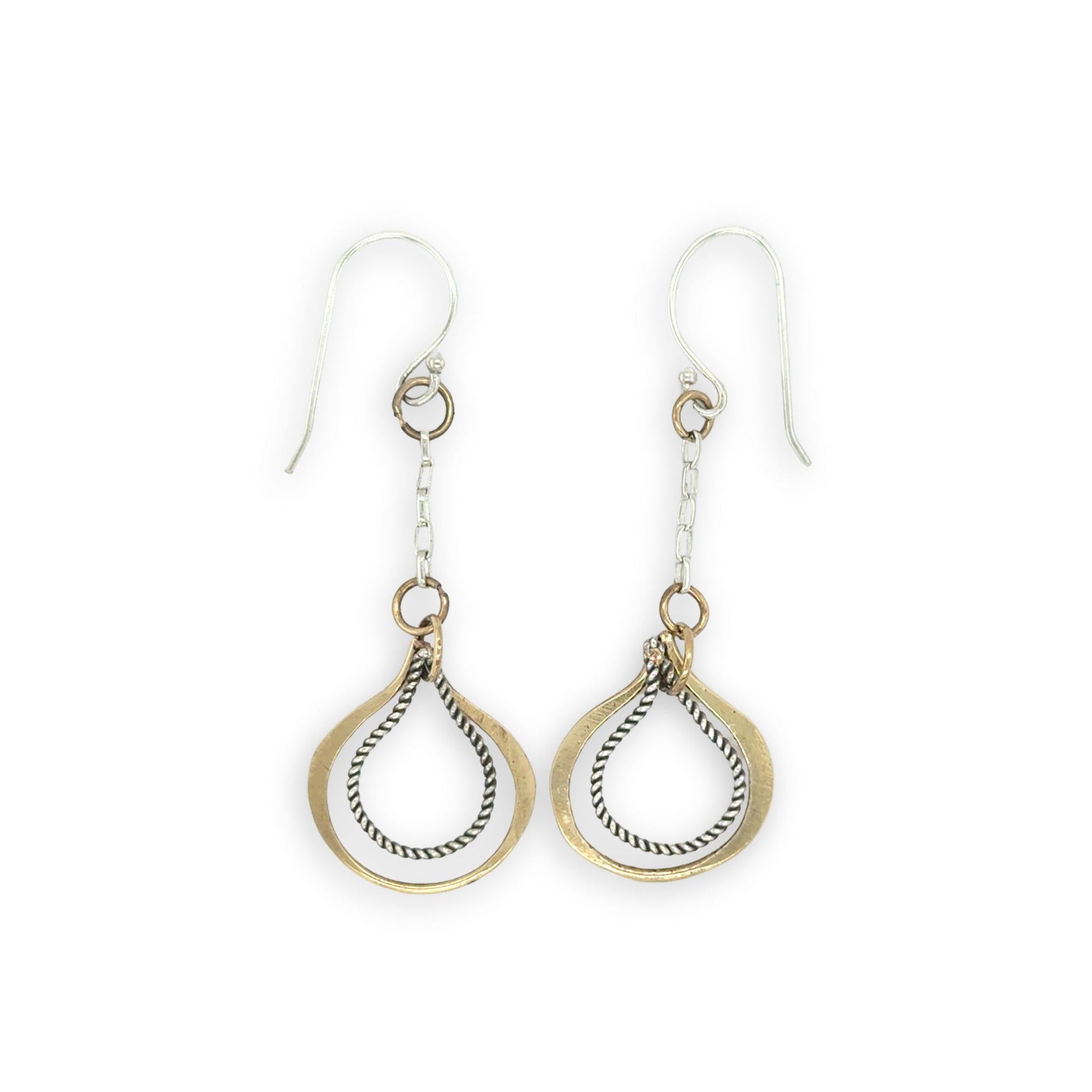 Hammered brass and oxidized sterling silver twist drop earrings on dainty chain