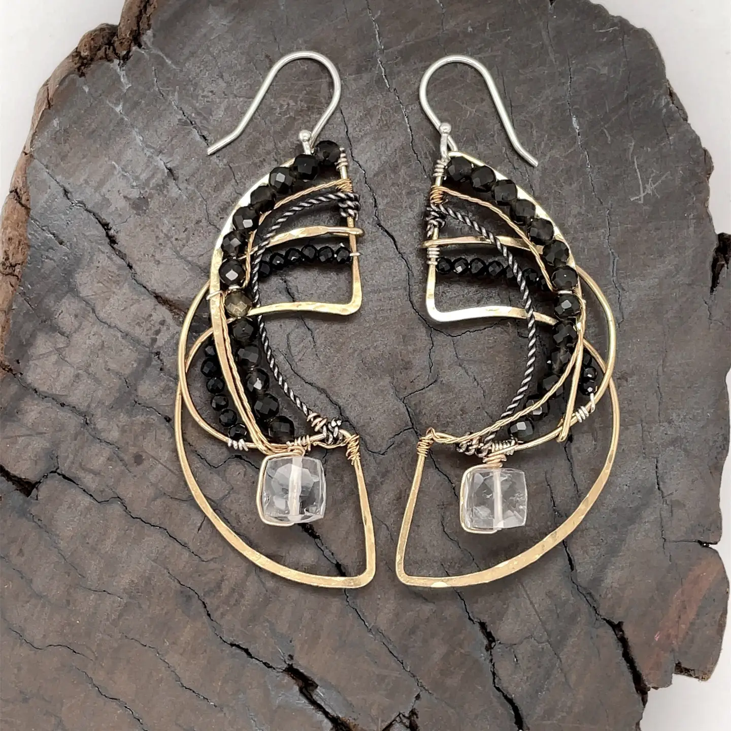 Brass hammered earrings line with dark olive cat's eye, black spinel, and quartz cube gemstones