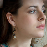 Brass hammered earrings line with dark olive cat's eye, black spinel, and quartz cube gemstones