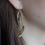 Pyrite gemstones and crystal on gold filled wire decorate brass interlocking frames to form a shooting star on gold filled earring hooks