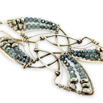 Pyrite gemstones and crystal on gold filled wire decorate brass interlocking frames to form a shooting star on gold filled earring hooks