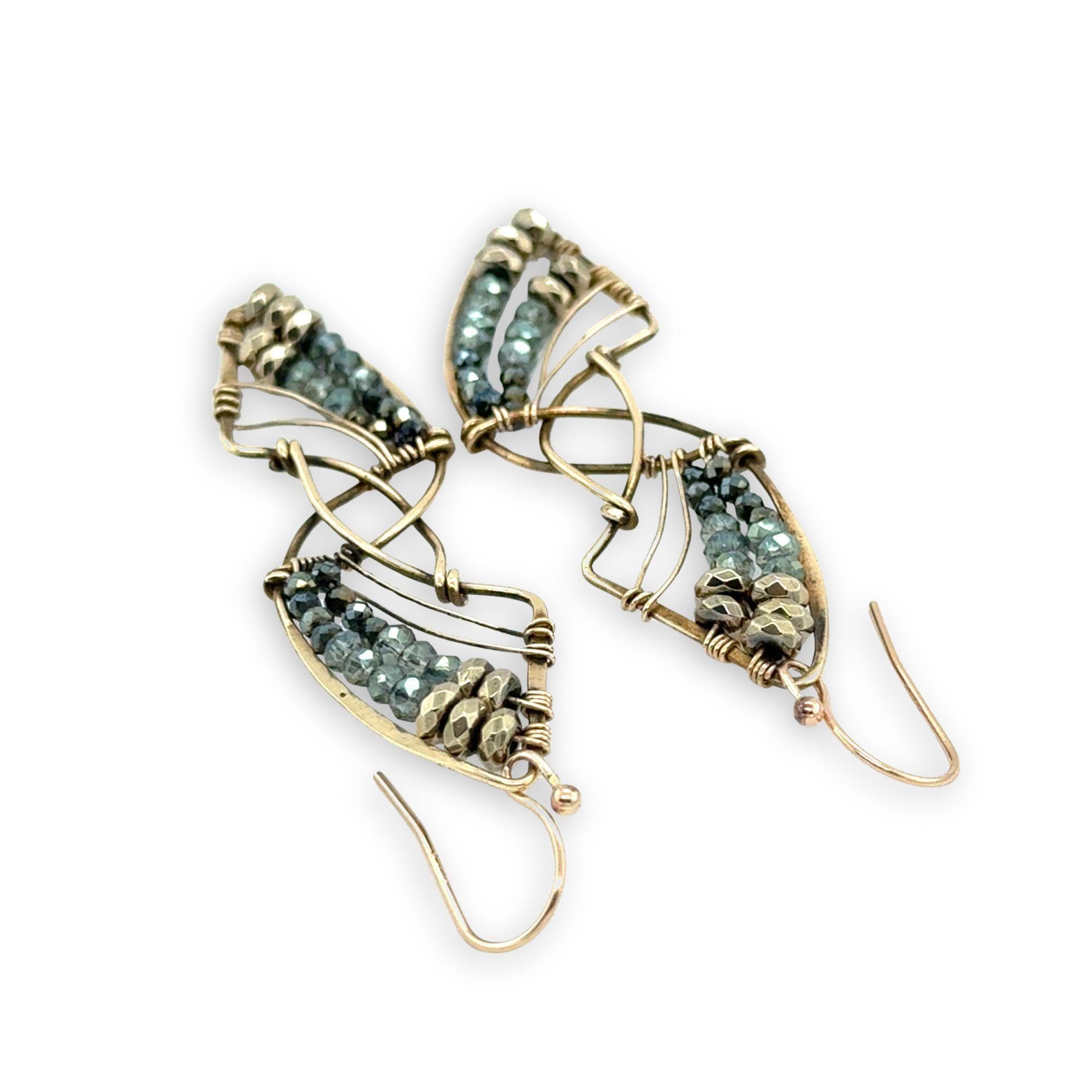 Pyrite gemstones and crystal on gold filled wire decorate brass interlocking frames to form a shooting star on gold filled earring hooks