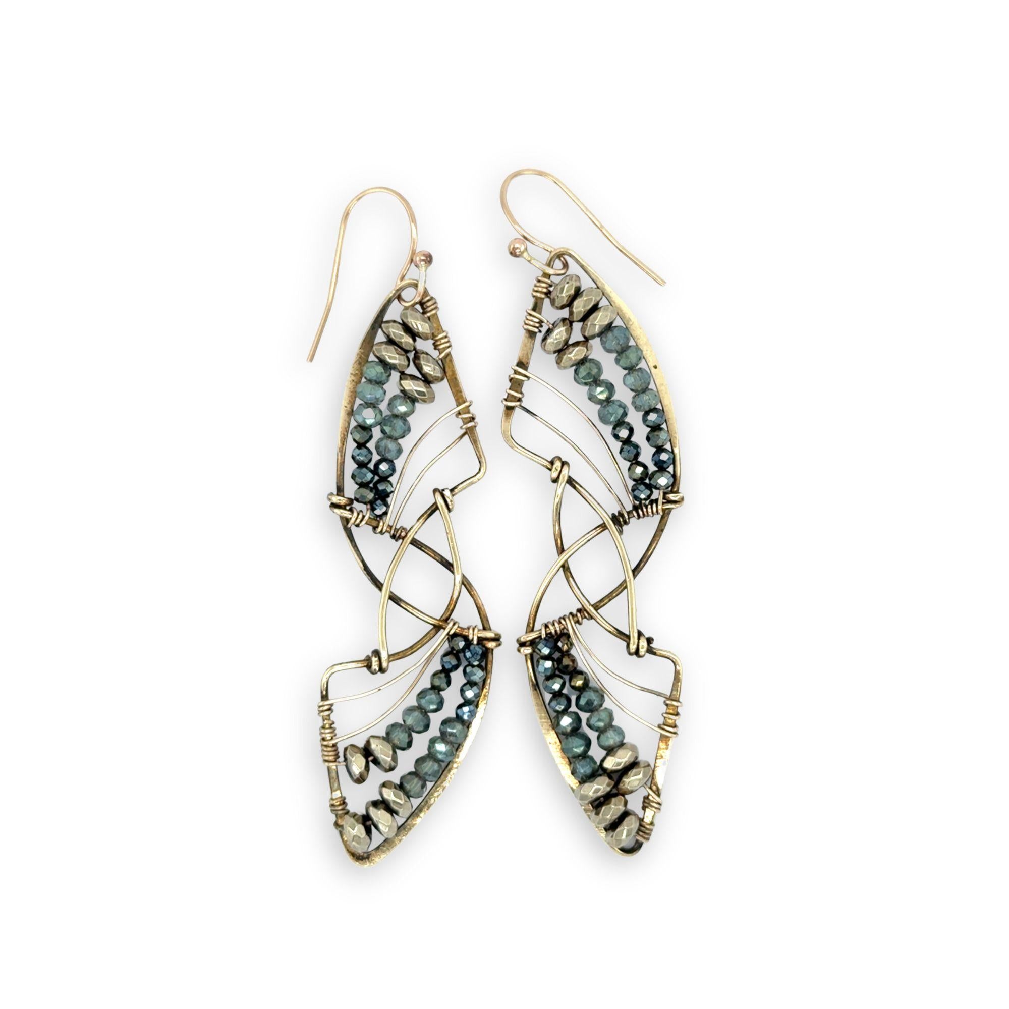 Pyrite gemstones and crystal on gold filled wire decorate brass interlocking frames to form a shooting star on gold filled earring hooks
