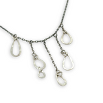 darkened sterling silver chain with five cascading, different sized hammered sterling silver teardrops necklace