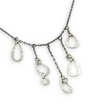 darkened sterling silver chain with five cascading, different sized hammered sterling silver teardrops necklace