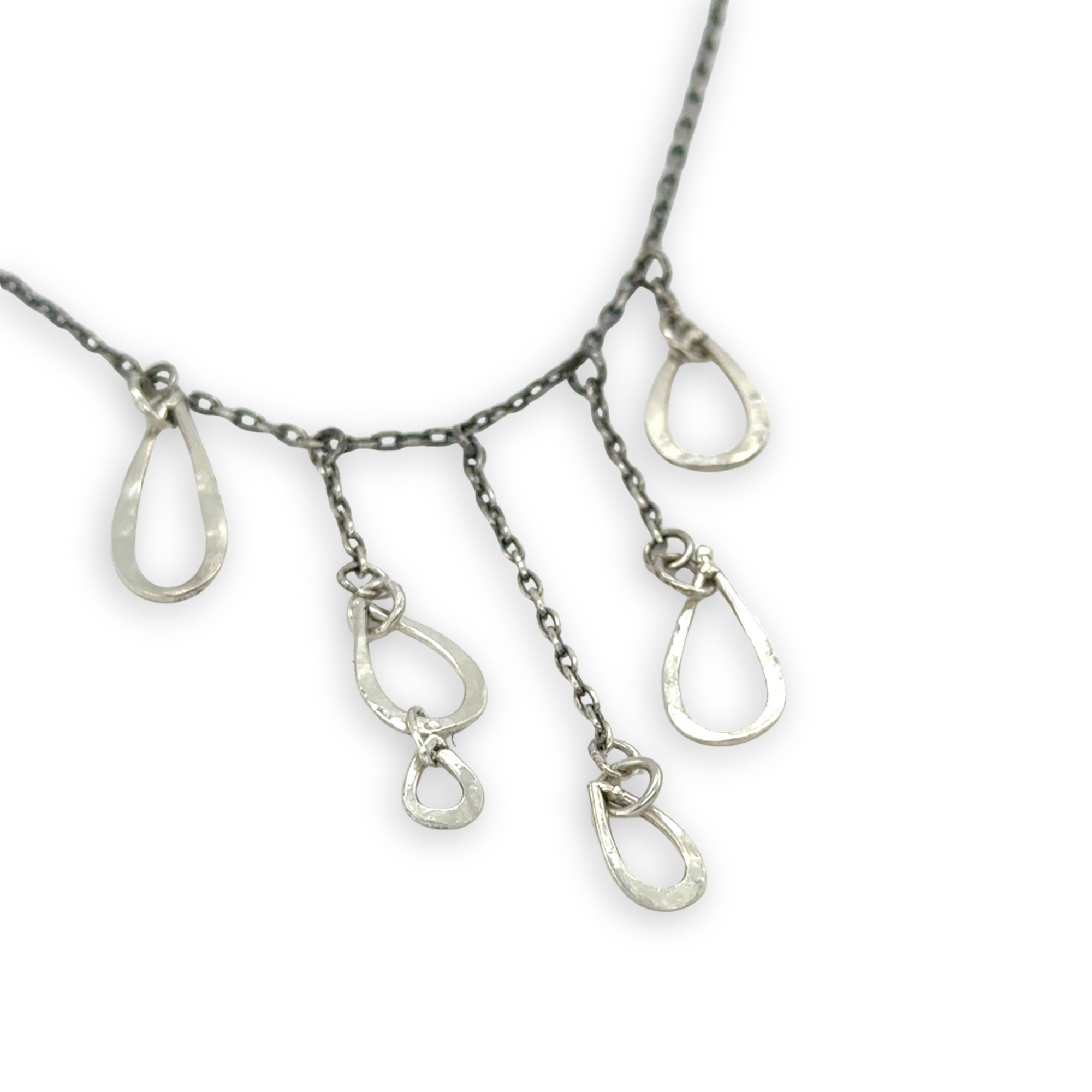 darkened sterling silver chain with five cascading, different sized hammered sterling silver teardrops necklace