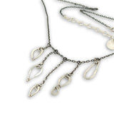 darkened sterling silver chain with five cascading, different sized hammered sterling silver teardrops necklace