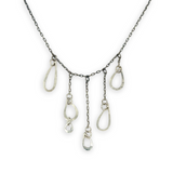 darkened sterling silver chain with five cascading, different sized hammered sterling silver teardrops necklace