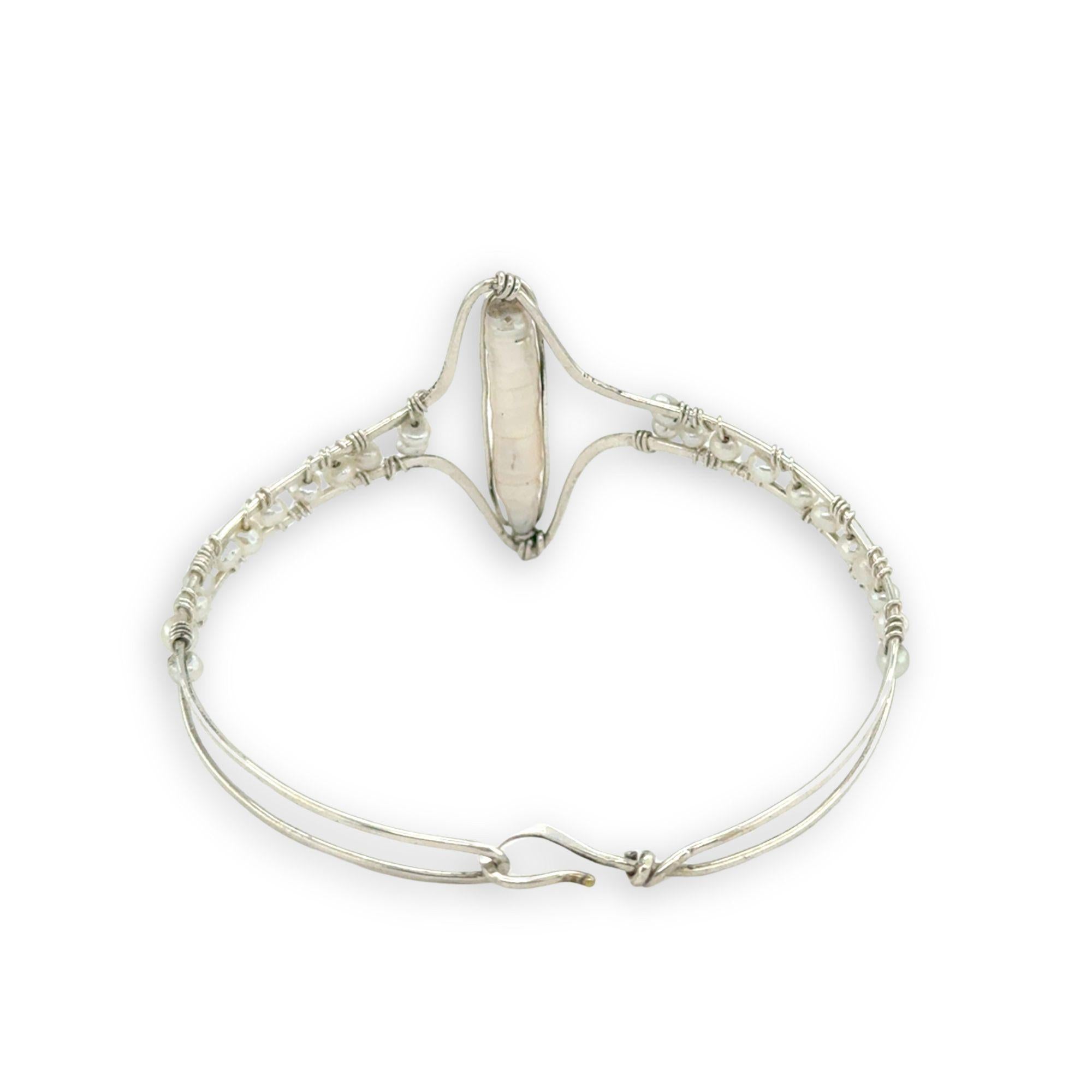Hammered sterling silver statement cuff bracelet accented with fresh water pearl stick and seed pearls