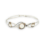 Sterling silver twisted bracelet with dark sterling twisted wire and fresh water pearls wrapped in gold fill wire