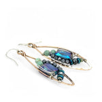 A pair of bronze marquise earrings with amazonite and pyrite gemstones surrounding rectangle crystals on sterling silver wire