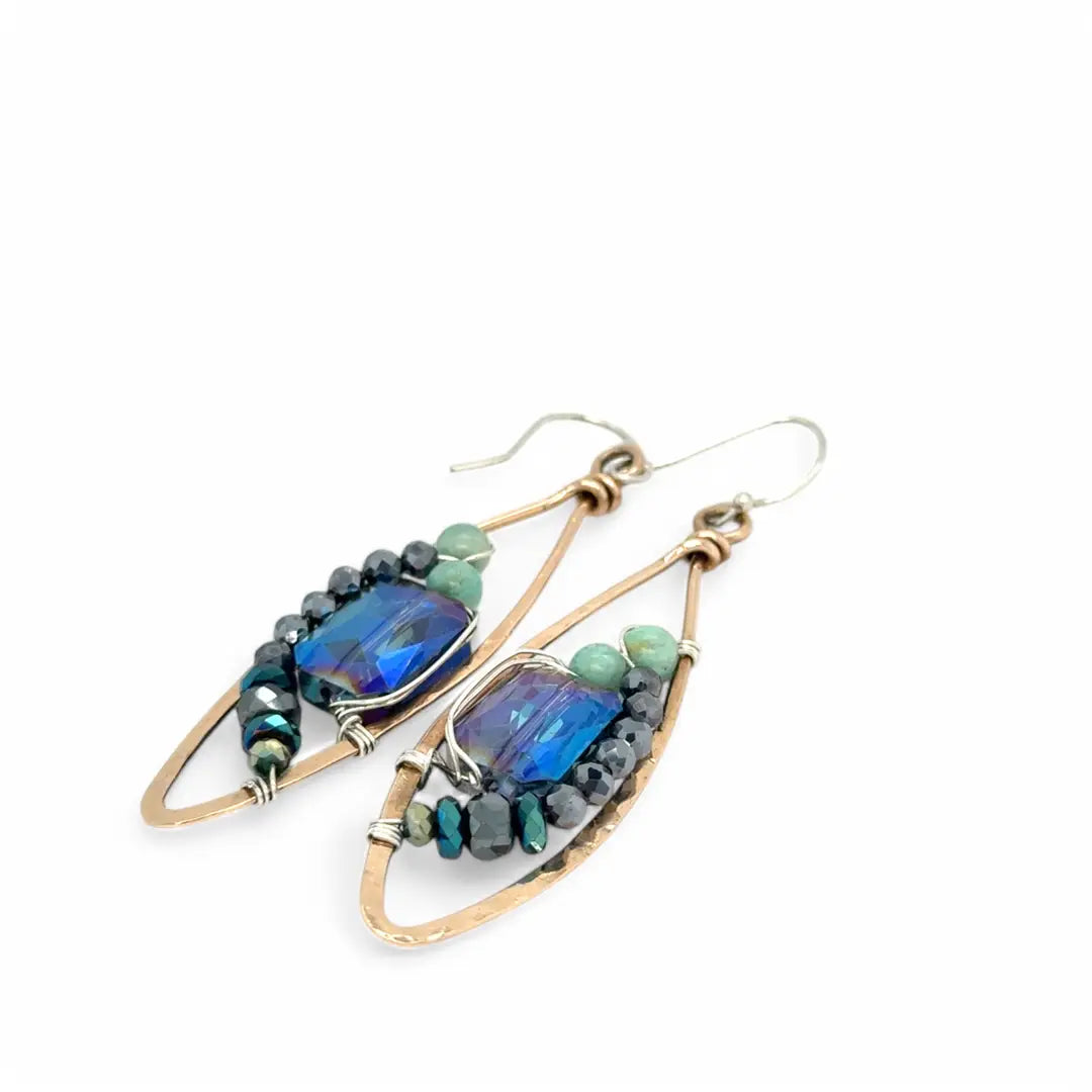 A pair of bronze marquise earrings with amazonite and pyrite gemstones surrounding rectangle crystals on sterling silver wire