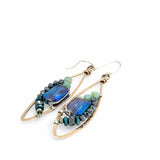 A pair of bronze marquise earrings with amazonite and pyrite gemstones surrounding rectangle crystals on sterling silver wire