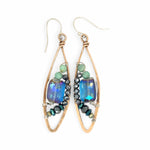 A pair of bronze marquise earrings with amazonite and pyrite gemstones surrounding rectangle crystals on sterling silver wire